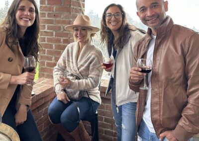 group of people holding wine glasses