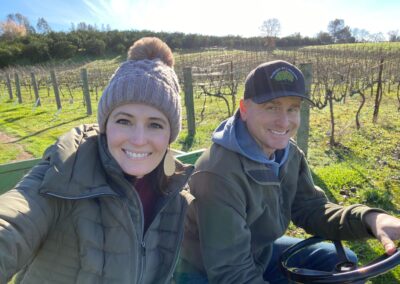 Rick and Jacque on a tractor in the vineyard